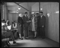 Courtroom spectators being searched during the Hickman kidnap and murder trial, Los Angeles, 1927-1928