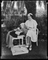 Miss Lillian Warde sitting with her crochet creations, Los Angeles, 1935