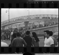 Chicano Moratorium Committee anti-war demonstrators cross pedestrian bridge