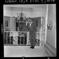 Actor Glenn Ford standing in the atrium of his bachelor residence in Beverly Hills, Calif., 1964