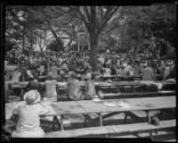 Attendees of the annual midsummer Iowa Picnic seated at tables in Bixby Park, Long Beach, 1926