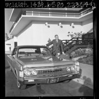 Lynn A. Townsend, president of Chrysler Corp., showing company's 1967 Imperial, Calif