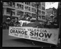 Truck bearing a banner advertising the Valencia Orange Show, 1921