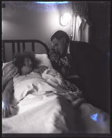 Judge Samuel R. Blake standing over his wife Beatrice B. Blake and their newborn daughter Barbara Blake, Los Angeles, 1927