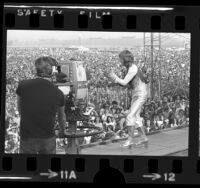 Ozzy Osbourne of Black Sabbath performing before crowd at California Jam concert in Ontario, Calif., 1974