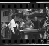 Richard Burton talking with director Vincent Minnelli on set of motion picture "Sand Pipers" in San Dimas, Calif., 1964