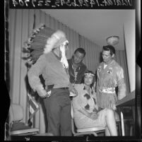 Four American Indian actors in ethnic dress at news conference about lack of work in Los Angeles, Calif., 1965