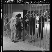 Long Beach Polytechnic High School student being searched for weapons at gate of school in Long Beach, 1969