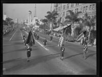 Paraders holding flags march in United Nations parade, Los Angeles, 1943