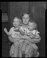 Shirley Marie Johnson and Donna Lee Johnson sit on their mother’s lap, upset over the loss of their father, Los Angeles, 1935