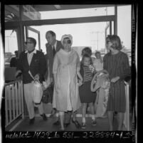 Actress Patricia Neal, first appearance after stroke, with her husband Roald Dahl and children at airport in Los Angeles, Calif., 1965