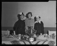 Hollywood Opera Reading Club members Mrs. Ben Lewis, Mrs. Harry Kimball, and Dr. Sonia Poushkareff celebrate Russian heritage, Los Angeles, 1936