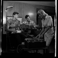 Three members of the folk-rock music group The Legendaires recording a song in Glendora, Calif., 1965
