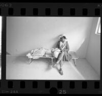 Homeless woman waiting for room at Ramona Gardens housing project in Los Angeles, Calif., 1987