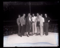 Boxers Armand Emanuel and Jim Maloney touch gloves during pre-fight instructions, Los Angeles, 1930