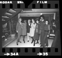 Designer Jean Louis posing with United Air Lines flight attendants wearing uniforms he designed, Los Angeles, Calif., 1973