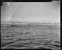 Barge and markers sit off-shore along the route of a proposed breakwater, Redondo Beach, 1938