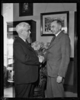 J. R. Hitchcock and H. P. Anewalt of Santa Fe Railroad shaking hands, Los Angeles, 1932