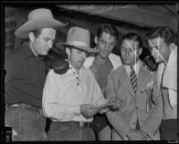 Dr. Ralph Wagner, Hank Hankinson, Ernie Wagner, and unidentified men viewing extortion note, Santa Clarita, 1935