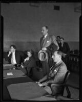 Newton Kendall, Dorothy Garland, and Buron Fitts as Spike O'Donnell, standing, attends court, Los Angeles, circa 1934