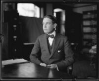 Distric Attorney Thomas Lee Woolwine sitting in an office, Los Angeles, 1920-1923