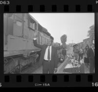 Mayor Tom Bradley holding press conference at train station in Los Angeles, Calif., 1986