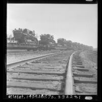 Tractors of the U.S. Marine Corps sitting on Union Pacific railcars in Los Angeles, Calif., 1966