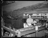 Katherine Butler working the California State Division of Fish and Game exhibit at the LA County Fair, Pomona, 1934