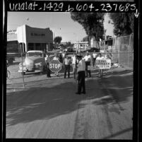 Mexican citizens waiting at U.S.- Mexican border gate in Andrade, Calif., 1967