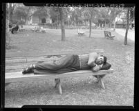 Joseph Raymond White-Eagle, disabled Indian war veteran, showing how he slept on park bench in Los Angeles, Calif., 1948