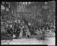 Crowd gathers in Warner Brothers convention hall for the opening session of the American Legion's conference, Los Angeles, 1936