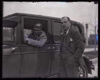 Stunt driver Hayward Thompson in his Pontiac Six beside his manager W. H. Watson, Los Angeles, 1927