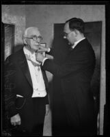 Georg Gyssling places the honor around William May Garland's neck, Los Angeles, 1933