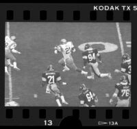 Eric Ball running ball during UCLA vs Iowa Hawkeyes football game, 1986