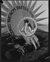 Newport Beach water parade, young woman on Long Beach Chamber of Commerce float representing 1932 Olympics, Newport Beach, 1932