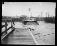 Glendale bridge destroyed by storm flooding in the Los Angeles River, Los Angeles, 1927