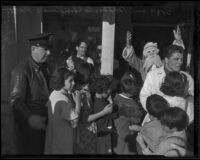 Children crowd outside the Bozzani Motor Company during its annual Christmas party, Los Angeles, 1935