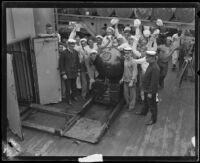 Navy sailors Gathered around a mine aboard the USS Baltimore, San Pedro, 1920-1921