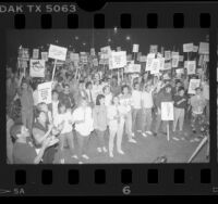 Demonstrators with signs reading "LaRouche Public Health Enemy #1," protesting AIDS Initiative, Calif., 1986