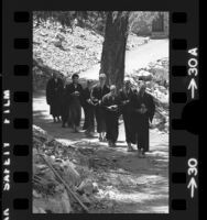 Zen Buddhist monks and students walking to lunch at Mt. Baldy Zen Center, Calif., 1973