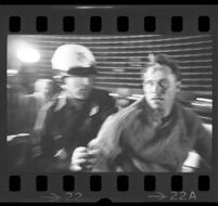 Protester pushed by police outside of Century Plaza Hotel where President Johnson is inside. 1967