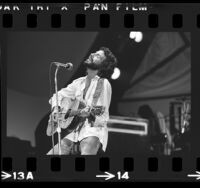 Cat Stevens (aka Yusuf Islam) performing on stage at the Inglewood Forum, Calif., 1976