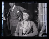 Clara Phillips sitting near jail cell at police station, Los Angeles, 1922