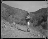 Man investigating Griffith Park fire, Los Angeles, 1933