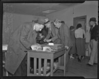 Deputy Sherriff Tom Humphries, Investigator John MacDonald and A. J. Gahring at a South Gate raid, 1935