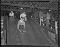 Party-goers on a slide at Venice Beach fun house, Venice (Los Angeles), 1936