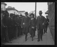 Accused killer Louise Peete is escorted to court by her husband Richard Peete (on her left) and bailiff Martin Aguirre, Los Angeles, 1921