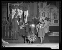 Student receiving banner from Archbishop Cantwell for support of Catholic foreign missions, Los Angeles, Calif., 1943