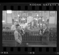 Five Talmud Torah Congregation of Los Angeles members posing in interior of synagogue, 1984