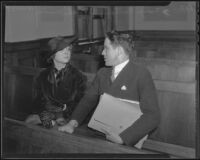 Assistant U. S. Attorney Jack Irwin sits beside Madge Bellamy as she listens to the testimony of her father in court, Los Angeles, 1935